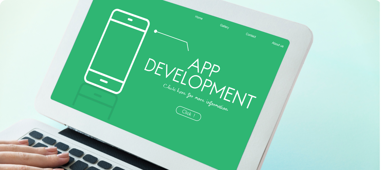 white laptop with app development website opened